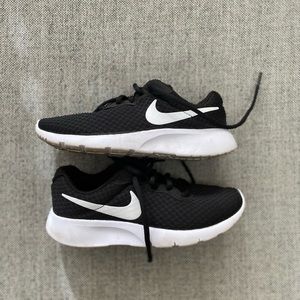 Youth black Nike lace up sneakers